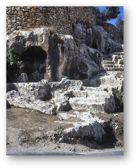 Ancient ruins of carved out tombs and steps